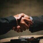 A Funeral for a Handshake?