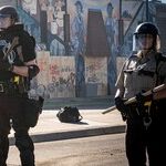 Assaulted and Vilified, the Cops Save the Cities